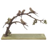 An Art Deco cold painted bronze of budgerigars perched on a branch