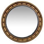 A large Regency style convex wall mirror