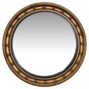 A large Regency style convex wall mirror