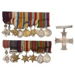 A George V military cross and two sets of WWI and WWII miniature medals