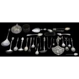 An assorted collection of 19th century and later silver spoons and sugar tongs