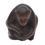 A Japanese Meiji carved wood netsuke of a monkey and young signed