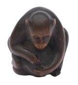 A Japanese Meiji carved wood netsuke of a monkey and young signed