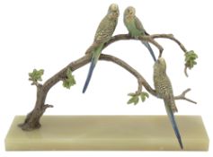 An Art Deco cold painted bronze of budgerigars perched on a branch