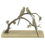 An Art Deco cold painted bronze of budgerigars perched on a branch