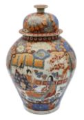 A 19th century Japanese imari vase and cover and another