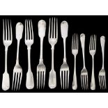 A matched set of six mostly William IV silver fiddle pattern table forks