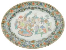 A 19th century famille rose oval dish painted with scholars