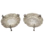 A pair of late Victorian silver embossed bonbon dishes