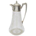 A Victorian silver mounted engraved claret jug