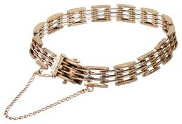 A 9ct gold stylised gate bracelet