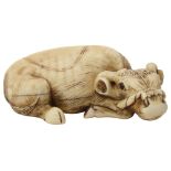 A Japanese ivory netsuke of a buffalo