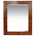 A William and Mary style seaweed marquetry inlaid fruitwood mirror