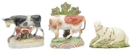 An early 19th century Staffordshire pearlware cow group