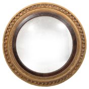 A Regency giltwood circular convex wall mirror
