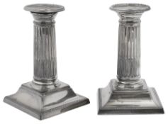 A pair of late Victorian silver dwarf column candlesticks