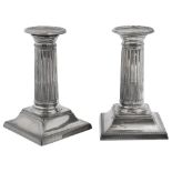 A pair of late Victorian silver dwarf column candlesticks