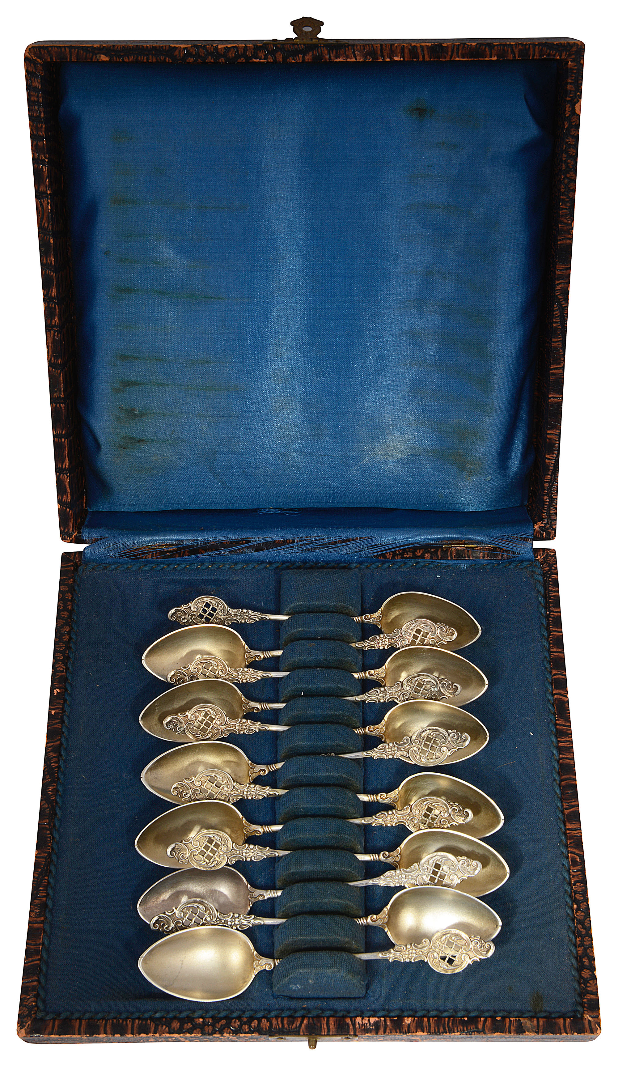A cased set of twelve continental .880 silver-gilt rococo style coffee spoons