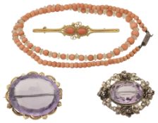 Two amethyst brooches, coral brooch and necklace