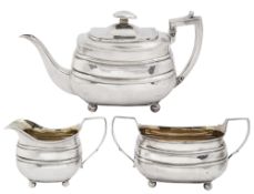 A George III silver three piece tea service