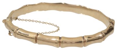 A 9ct gold stiff bangle