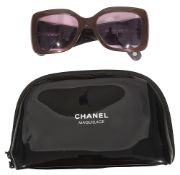 A pair of Chanel sunglasses and make up bag