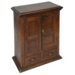 A 19th century oak apothecary's tabletop cabinet