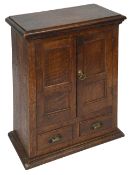 A 19th century oak apothecary's tabletop cabinet