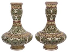 A pair of Zsolnay double walled reticulated porcelain vases c.1900