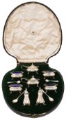 A cased George V eight piece silver cruet set