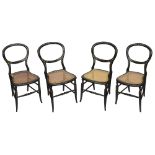 A set of four Victorian mother of pear inlaid ebonised balloon back chairs,