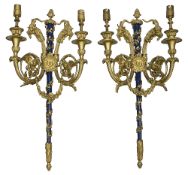 A pair of French Louis XVI style gilt bronze twin light appliques after Pierre Gouthiere