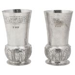 A pair of late Victorian Arts and Crafts silver vases