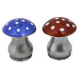 A pair of novelty silver and guilloche enamel toadstool pepper pots