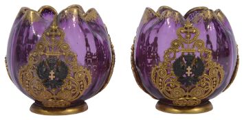 A pair of small late 19th century ormolu mounted cranberry glass vases