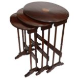 An Edwardian mahogany nest of three occasional tables