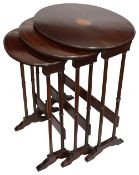 An Edwardian mahogany nest of three occasional tables