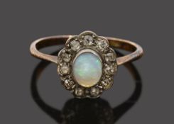 An opal diamond cluster ring