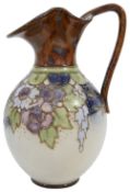 A Royal Doulton jug by Florrie Jones