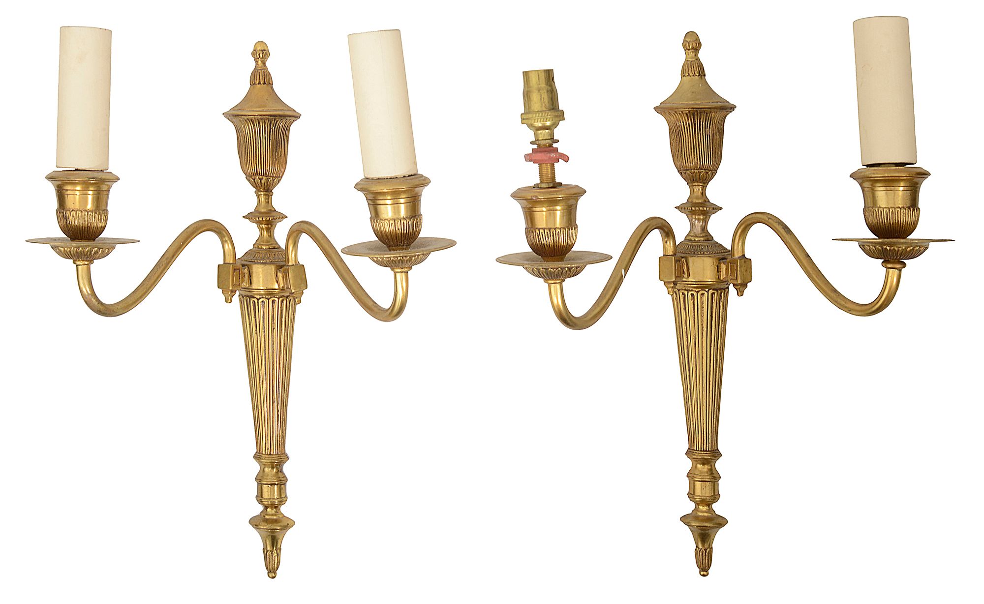 A pair of Edwardian gilt brass twin light wall appliques