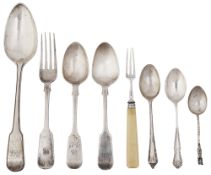 A small collection of silver flatware