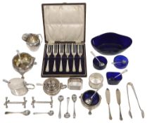 A collection of silver to include cauldron salts, a pair of knife rest etc.