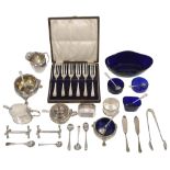 A collection of silver to include cauldron salts, a pair of knife rest etc.