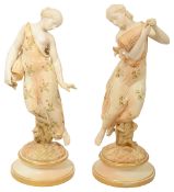 A pair of large Royal Worcester blush ivory figures of water carriers