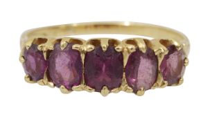 An early 20th century garnet five stone ring