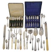 A collection of silver to include serving items and coffee spoons