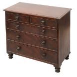 An early 19th century miniature mahogany chest of drawers