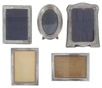 Five silver easel back photograph frames