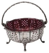 An early Victorian silver swing handled sugar basket