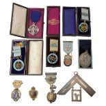 A large Masonic silver collar jewel and a selection of moslty silver jewels